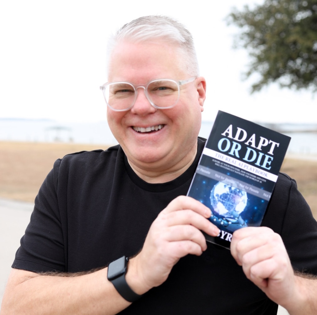 Paul Byrne holding Adapt or Die - The Real AI Playbook