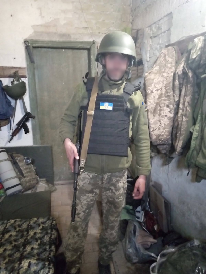 Ukrainian defender ready for patrol with donated body armor