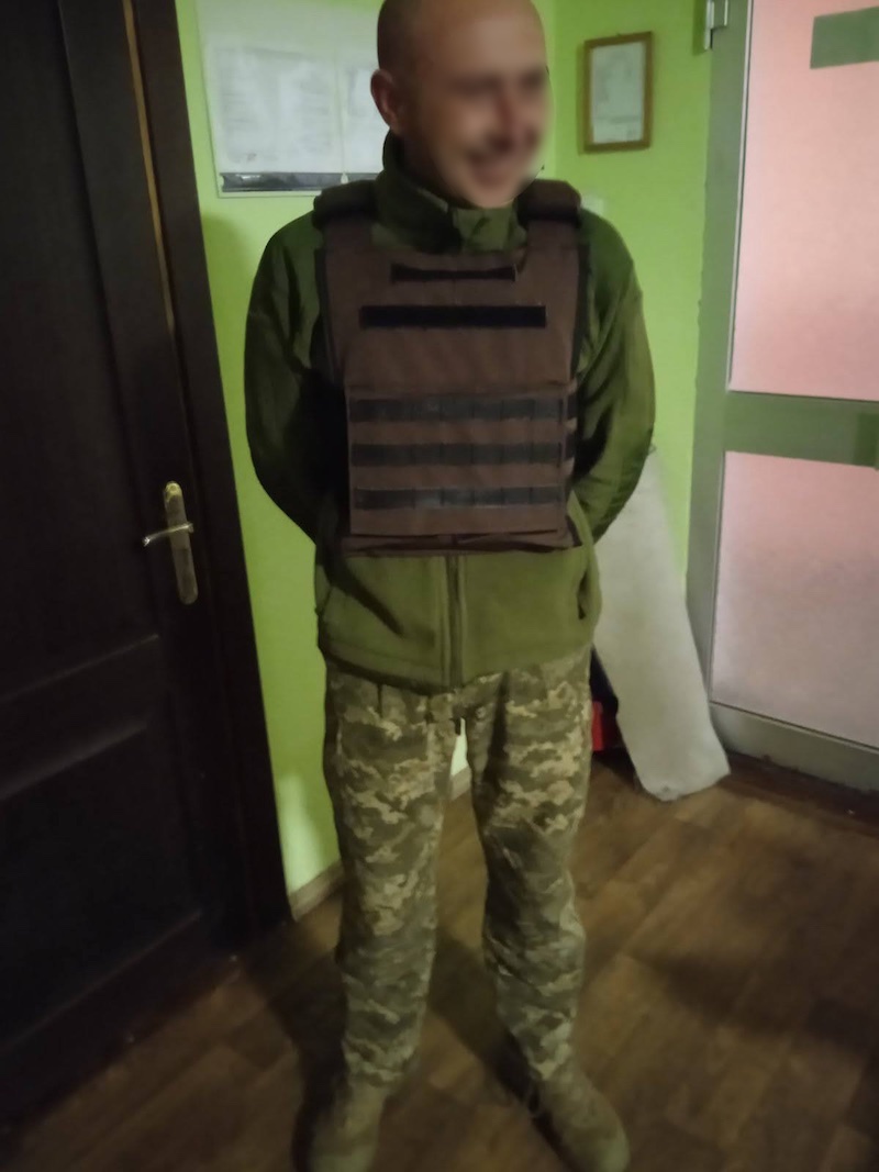 Soldier happy to be protected by body armor vest